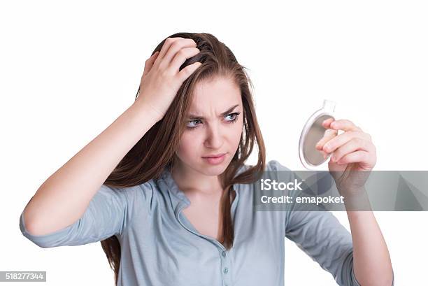 Woman Looking At The First Grey Hair On Her Scalp Stock Photo - Download Image Now - Gray Hair, Women, One Woman Only