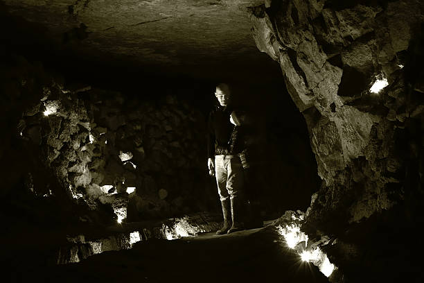 istock Man and child underground in an abandoned mine 518280636