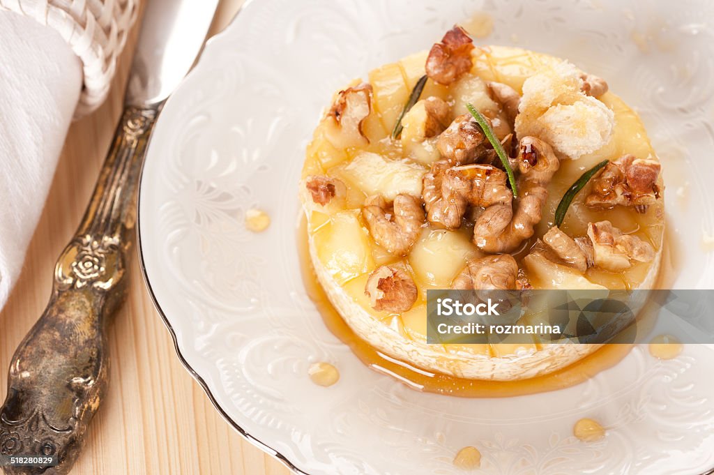 Baked cheese Camembert  with honey, nuts and toast Appetizer Stock Photo