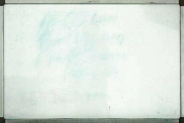 Old whiteboard for office with traces of stains and spots stock photo