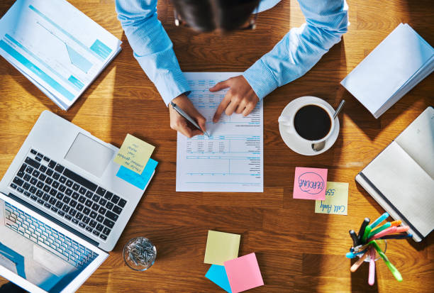 istock Businesswoman working on a report or questionnaire 518281342