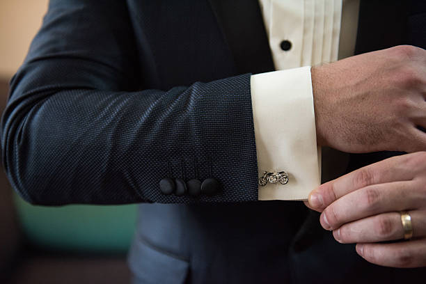 istock Hands of wedding groom getting ready 518281808