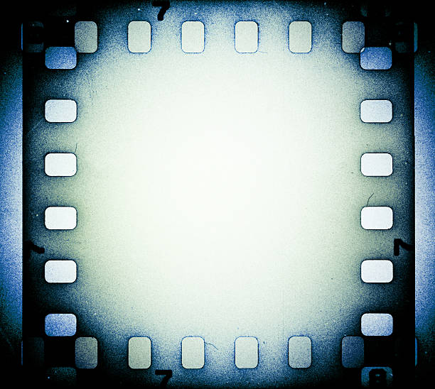 istock Grunge scratched film strip background. 518281873