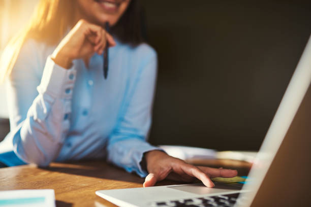 istock Closeup woman using laptop 518281884