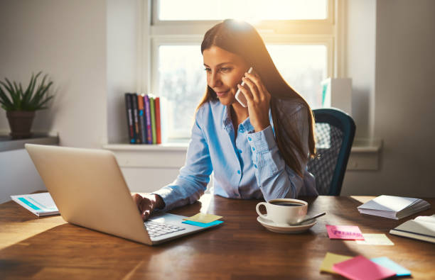 Woman working on laptop at office