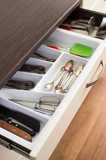 istock Spoons, forks and knives in cutlery box drawer 518282530