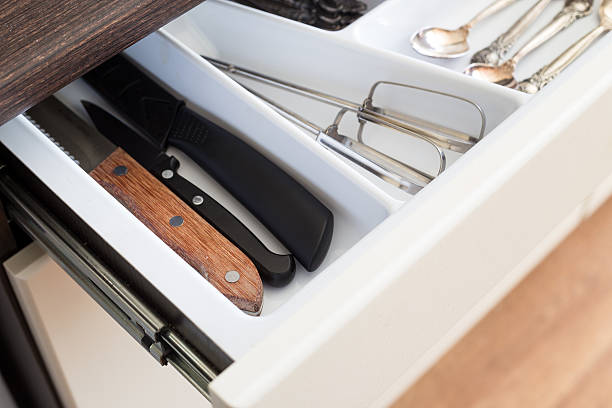 istock Spoons, forks and knives in cutlery box drawer 518282570