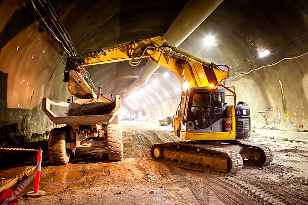 istock Concrete Road Tunnel Construction Excavator 518282726
