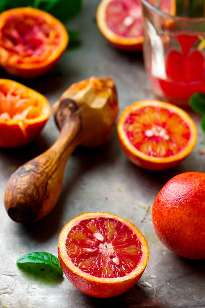 istock fresh bloody oranges cut in half 518282814