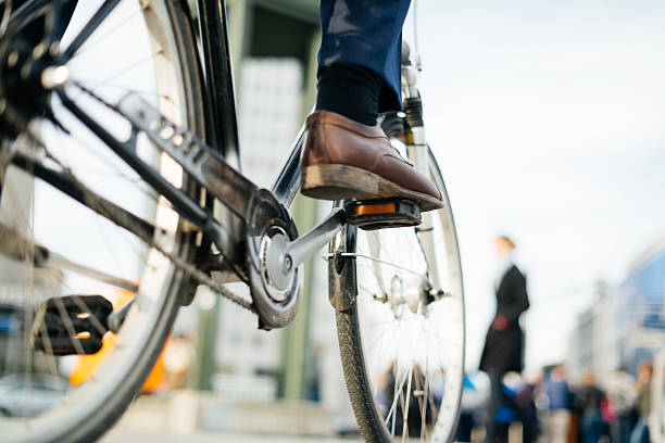 istock Legs Of Businessman On Bicycle 518283608