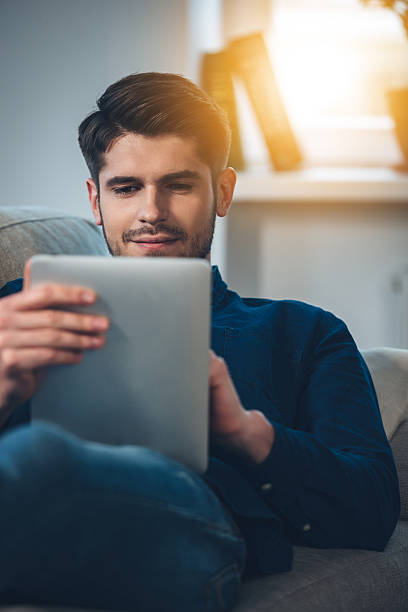 istock Enjoying his new digital tablet. 518285718