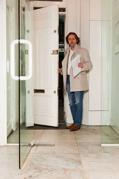 istock Business man entering office. 518291309