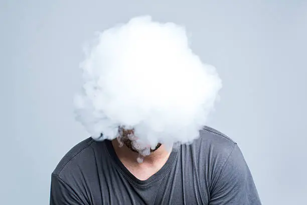 Photo of Face covered with thick smoke