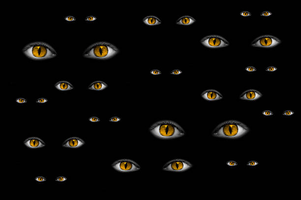 istock Many strange yellow eyes shining in the black 518292573