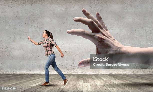 Woman Escape From Hand Stock Photo - Download Image Now - Adult, Aggression, Control