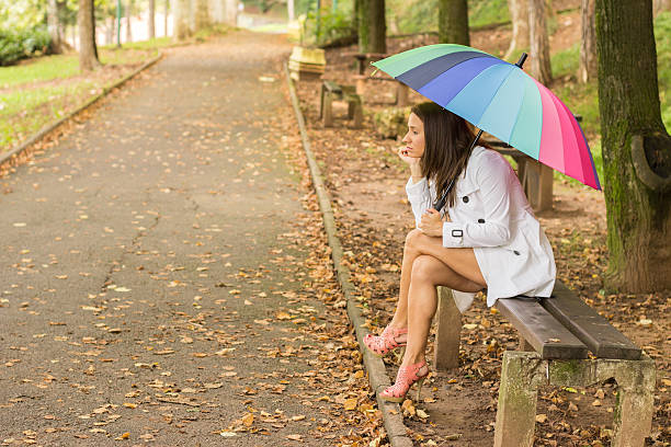 istock Beautiful angry girl sitting alone and waiting 518295377