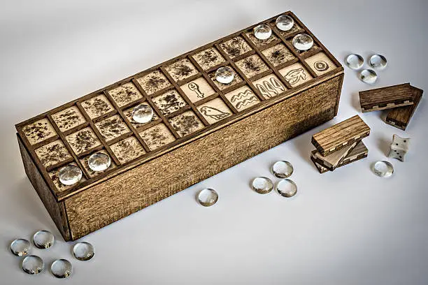 Senet boardgame with dice and pawn
