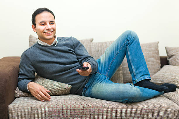 istock Portrait of a man watching TV 518296855