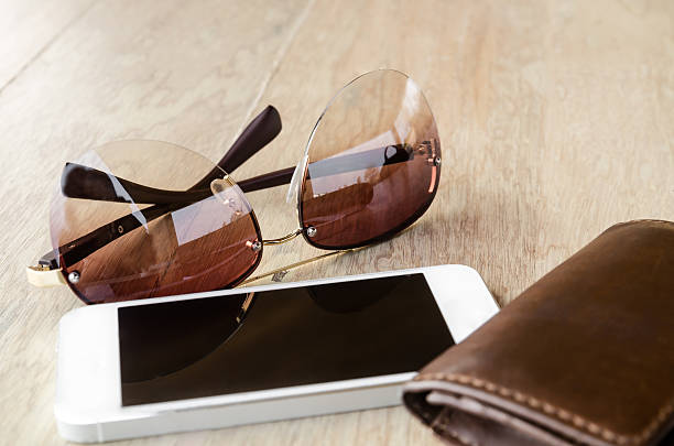 istock tinted sunglasses and smartphone 518306528