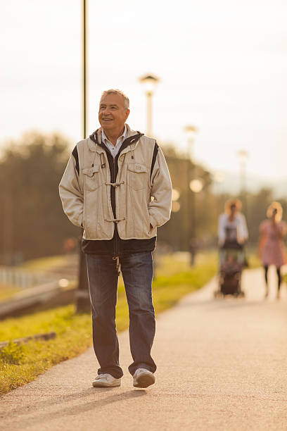 istock Happy senior man walking on the promenade 518306965