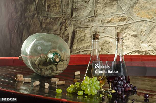 Still Life With Wine Glasses Wine Bottles And Grapes Stock Photo - Download Image Now