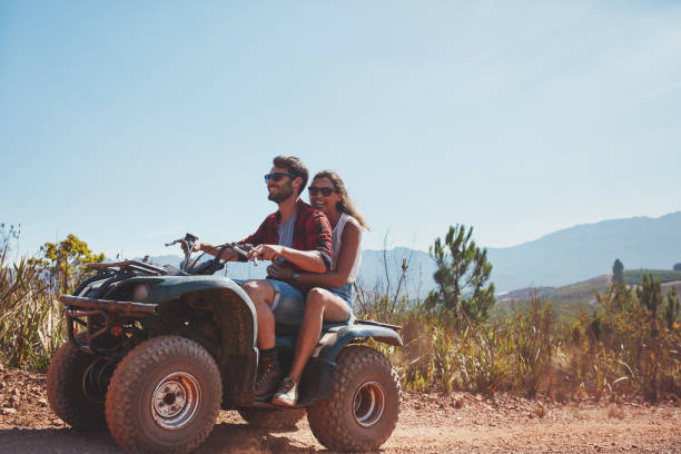 istock Couple riding on a quad bike 518308018