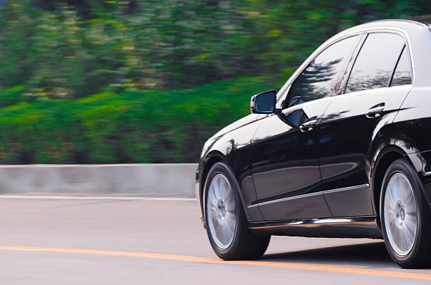 istock Black benz running up the mountain road 518308481