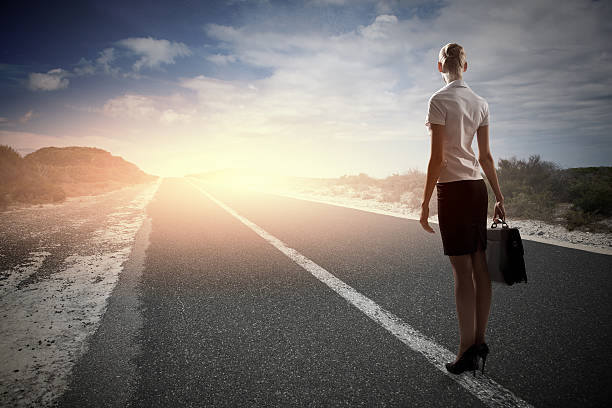 istock Businesswoman on road 518309031