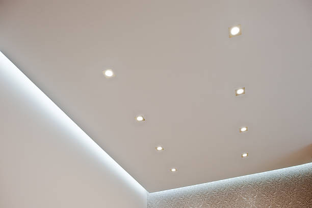 istock Eight golden lighting lamps built into the ceiling turn on 518309212