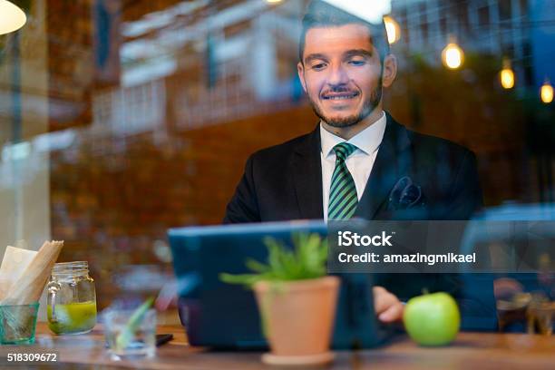 Businessman Using Laptop Computer In Coffee Shop Stock Photo - Download Image Now - 30-34 Years, 30-39 Years, Adult