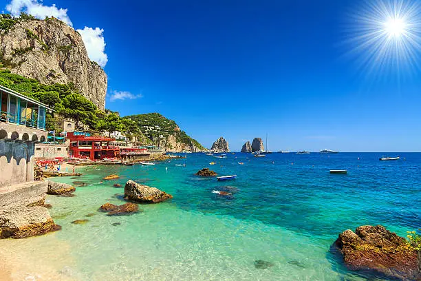 Faraglioni cliffs and wonderful beach in Capri island,Italy,Europe