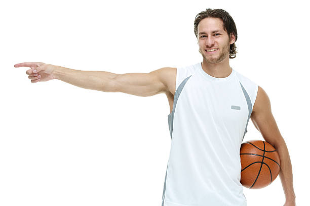istock Smiling sports man pointing away 518310278