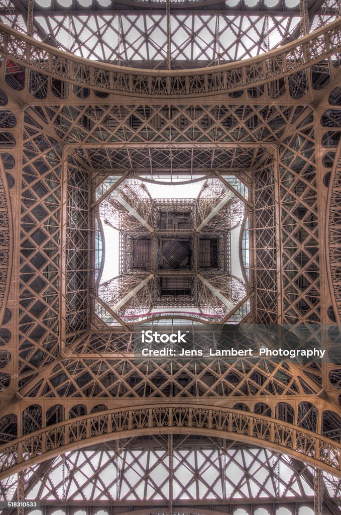 Straight Up Standing underneath the Eiffel Tower, dead center looking up. Eiffel Tower - Paris Stock Photo