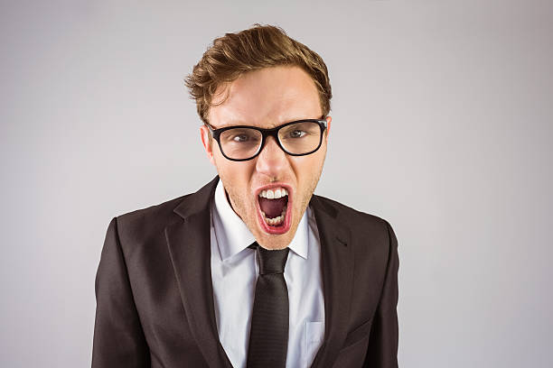 istock Young angry businessman shouting at camera 518310535