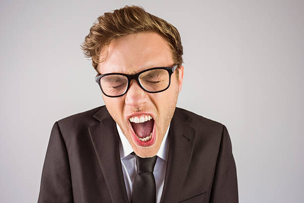 istock Young angry businessman shouting at camera 518310537
