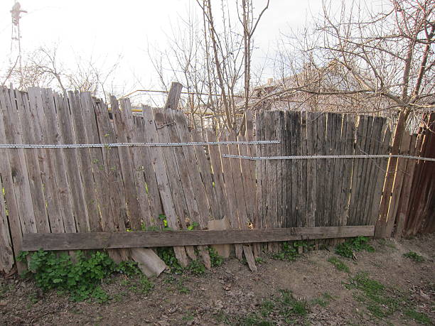 istock Old wooden broken fence 518310944