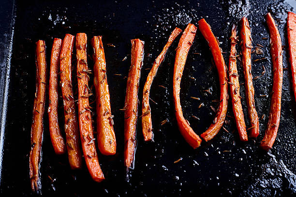 istock Roasted carrots with caraway food close up 518311100