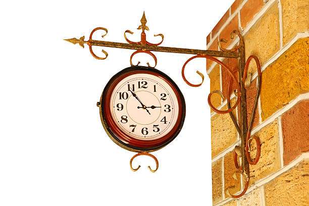 istock Vintage watch on yellow brick wall. 518311161