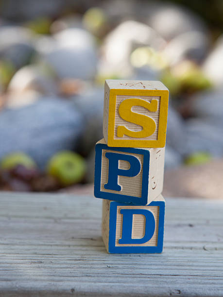 Sensory Processing Disorder (SPD) blocks Blocks arranged to spell SPD, Sensory Processing Disorder. A disorder of the central nervous system common amonst children with Autism. german social democratic party photos stock pictures, royalty-free photos & images