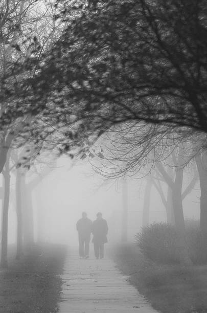 istock Couple Walking in the Fog 518312875
