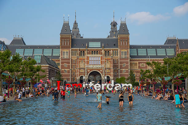 People in the pool in front of Rijksmuseum in Amsterdam stock photo