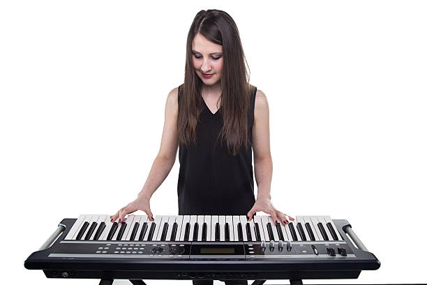 istock Girl playing on synthesizer 518322386
