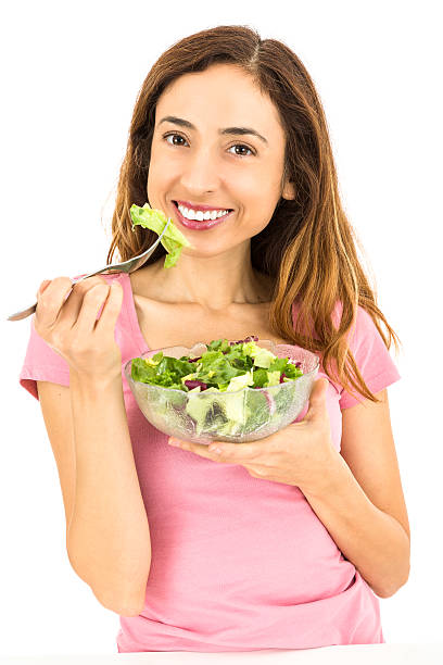 istock Weight loss woman eating salad 518323426