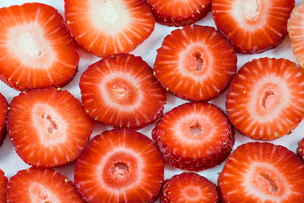 istock Red tasty sliced strawberries 518325324