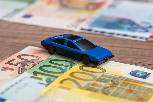 istock blue toy car on euro banknote 518326280