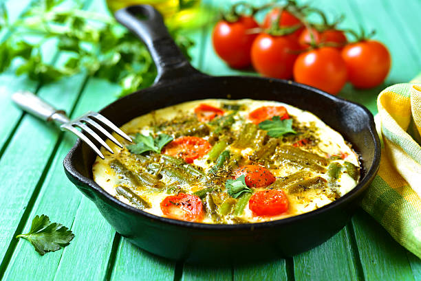 istock Omelet with tomatoes and asparagus bean. 518327928