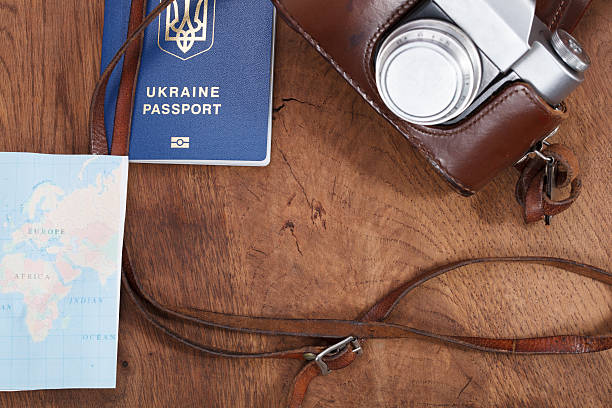 istock map, old camera and passport . Travel concept 518329196