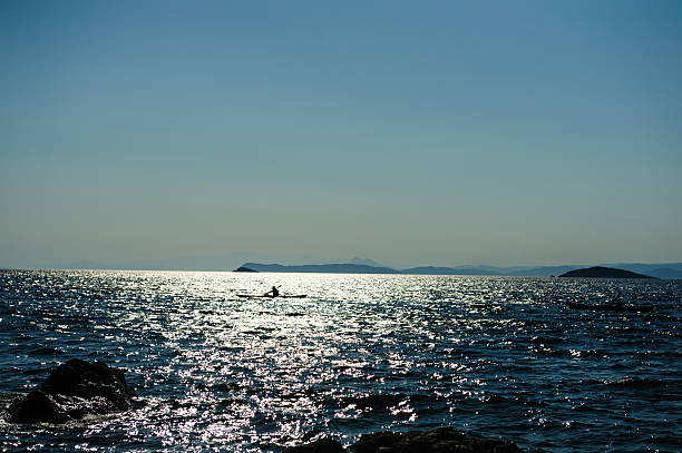 Silhouette of kayak in the sea of Skopelos