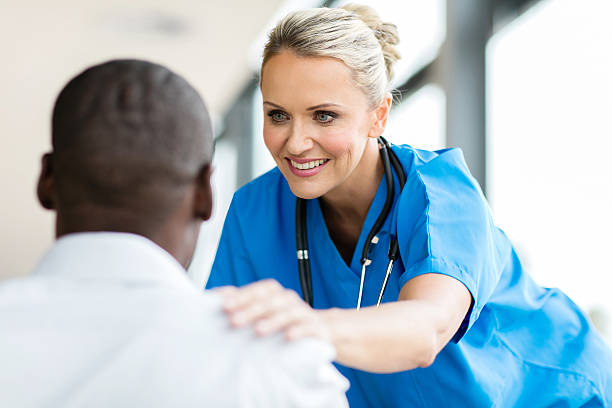 istock medical doctor comforting pateint 518334326