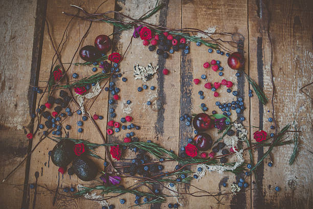 istock Berries, plums and avocados on barnwood 518334610